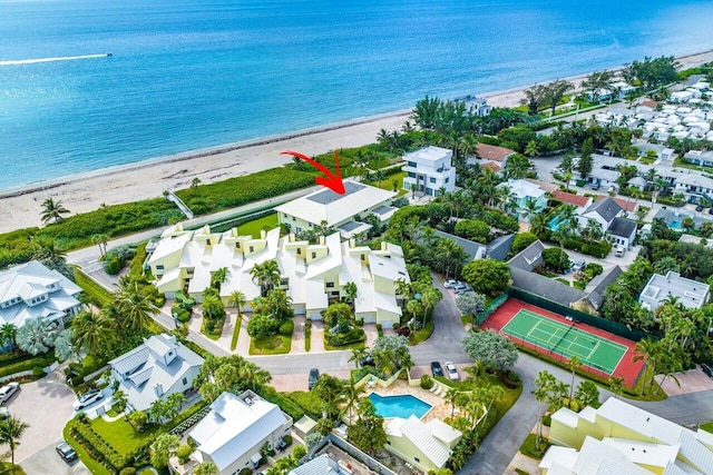 bird's eye view with a water view and a view of the beach