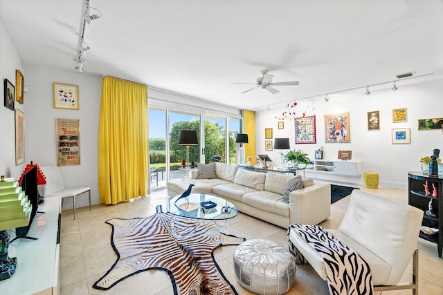 living room featuring ceiling fan, light tile patterned flooring, and track lighting