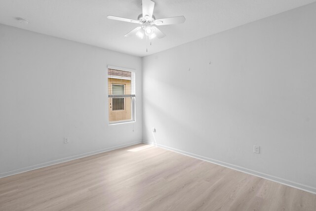 unfurnished bedroom featuring ceiling fan, light colored carpet, and a closet