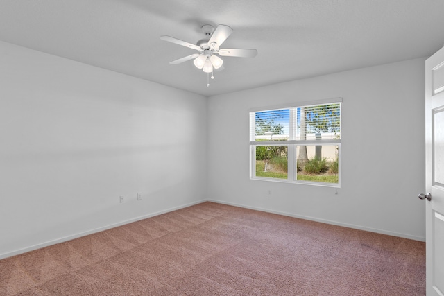 empty room with carpet flooring and ceiling fan