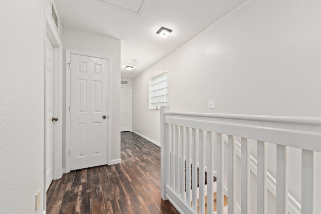 hall with dark hardwood / wood-style flooring