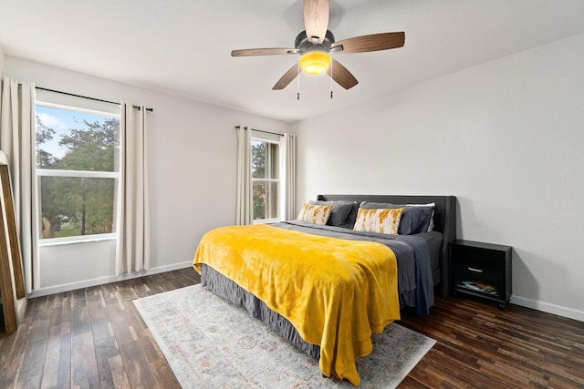 bedroom featuring ceiling fan and dark hardwood / wood-style flooring