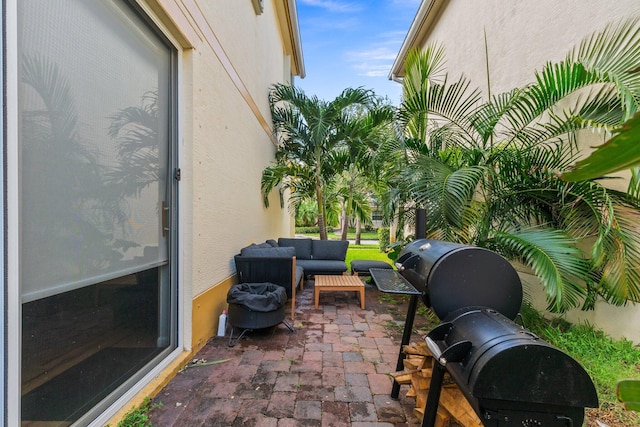 view of patio with a grill and an outdoor hangout area