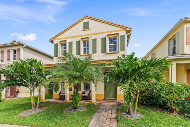 view of front of home with a front lawn