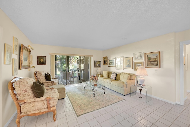 living room with light tile patterned floors and a textured ceiling