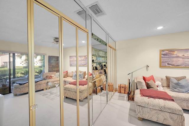 bedroom featuring access to exterior, ceiling fan, and light colored carpet