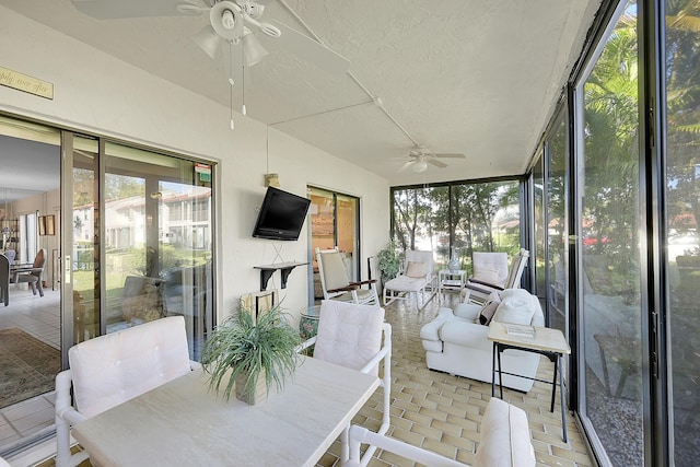 sunroom / solarium with ceiling fan