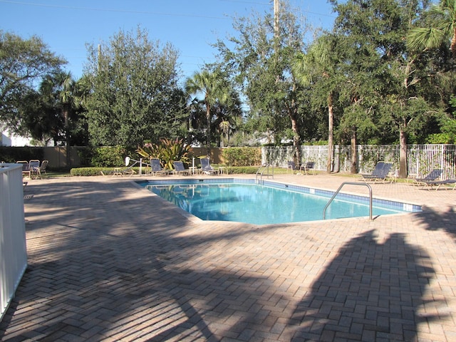 view of swimming pool with a patio area