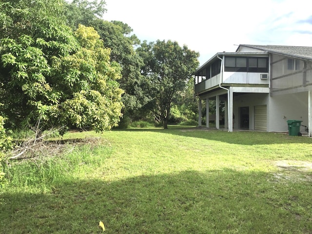 view of yard featuring a sunroom