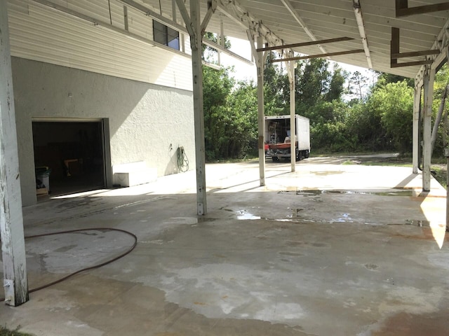 view of patio / terrace with a carport