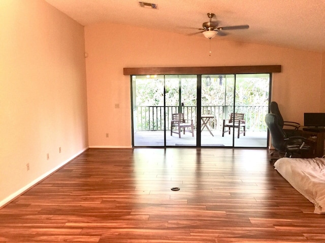 unfurnished living room featuring hardwood / wood-style floors and lofted ceiling