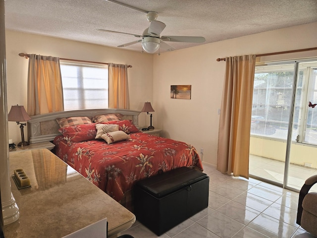 bedroom featuring light tile patterned floors, a textured ceiling, multiple windows, and ceiling fan