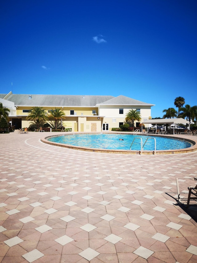 view of swimming pool with a patio area