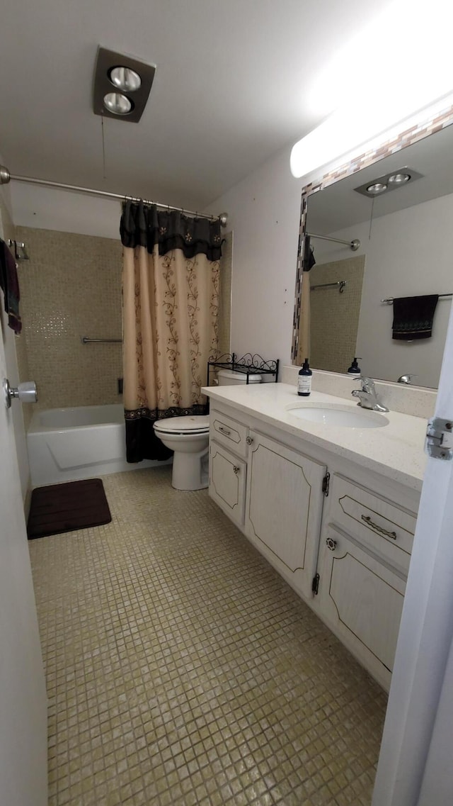 full bathroom featuring shower / bath combination with curtain, vanity, and toilet