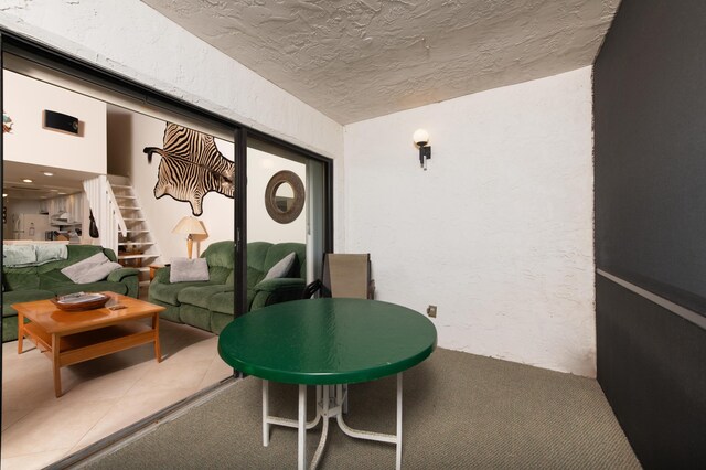 living room with light tile patterned floors, vaulted ceiling, and wood ceiling