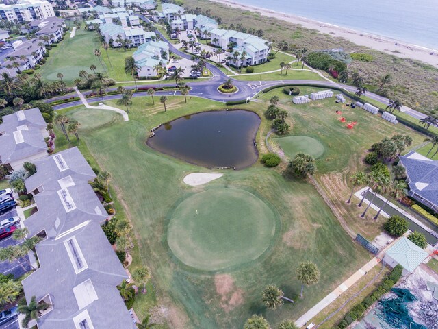 bird's eye view featuring a water view and a view of the beach