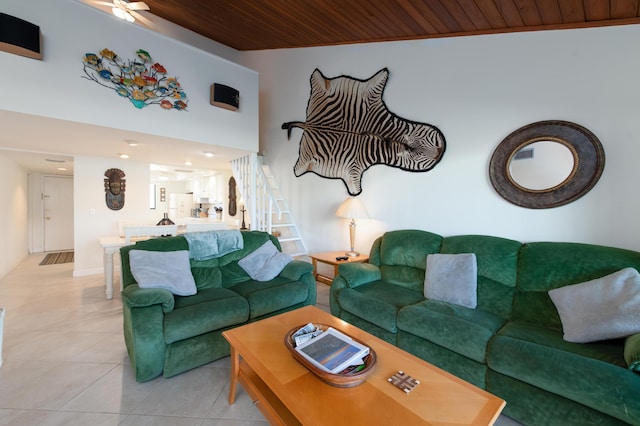 living room featuring ceiling fan, light tile patterned floors, and wood ceiling