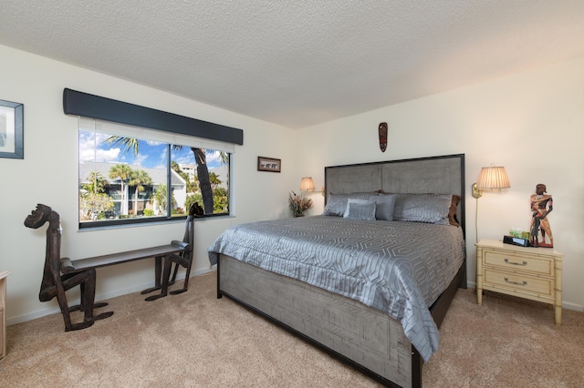 carpeted bedroom with a textured ceiling