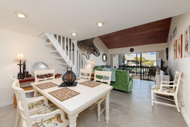 2400 S Ocean Dr Unit 6523, Fort Pierce, FL 34949 - dining area featuring light tile patterned floors, baseboards, stairs, vaulted ceiling, and wooden ceiling
