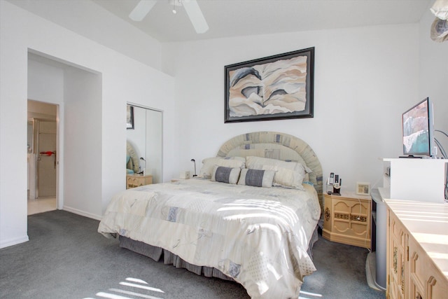 bedroom with dark colored carpet, a closet, ceiling fan, and lofted ceiling