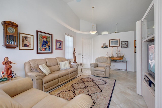 living room featuring high vaulted ceiling