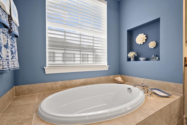 bathroom featuring tiled bath