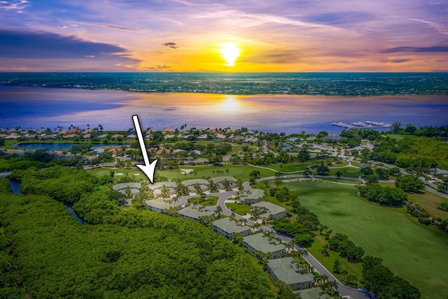 aerial view at dusk with a water view