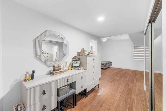 hall with light hardwood / wood-style flooring