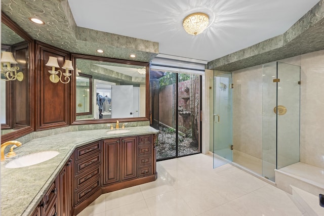 bathroom featuring tile patterned floors, vanity, and an enclosed shower