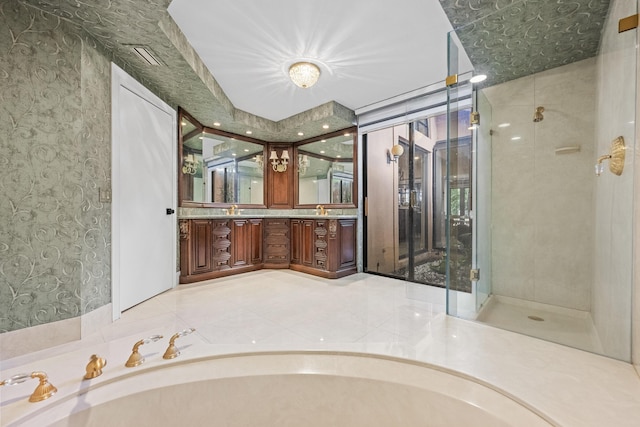 bathroom featuring plus walk in shower and vanity