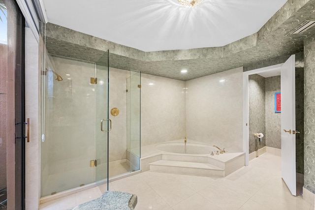 bathroom featuring tile patterned flooring and independent shower and bath