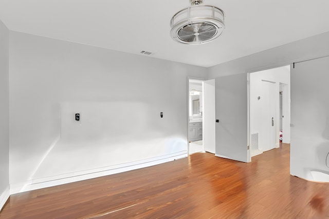 empty room with wood-type flooring