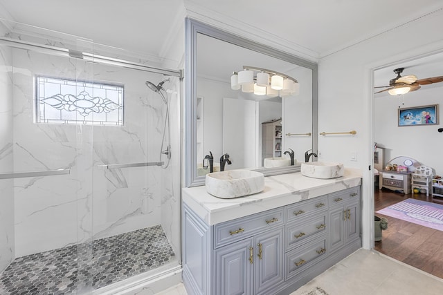 bathroom with vanity, crown molding, ceiling fan, and hardwood / wood-style flooring