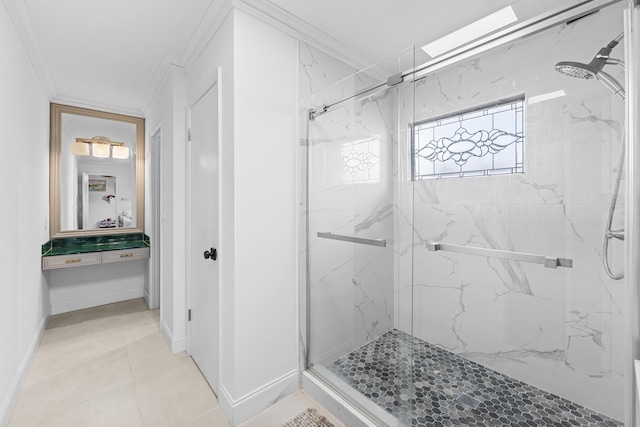 bathroom featuring a shower with door, tile patterned flooring, and ornamental molding