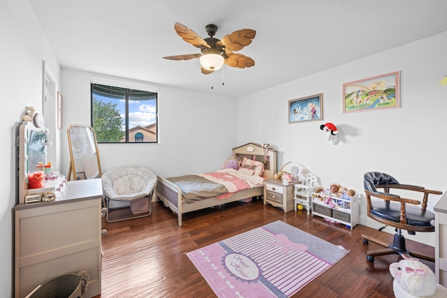 bedroom with ceiling fan and dark hardwood / wood-style flooring