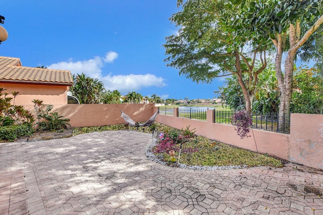 view of patio / terrace with a water view