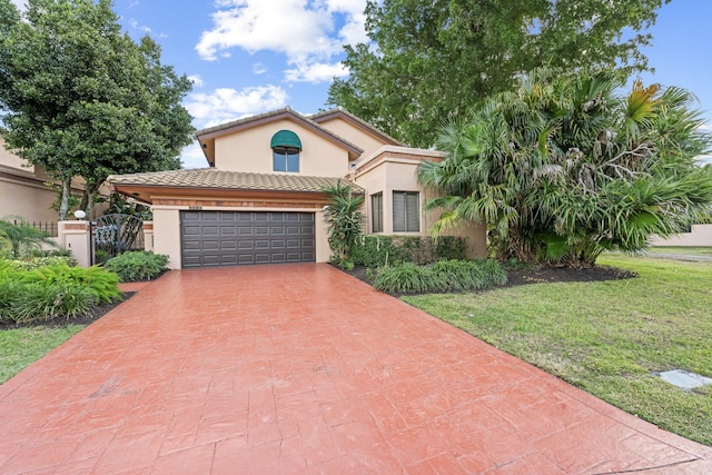 mediterranean / spanish house featuring a front lawn