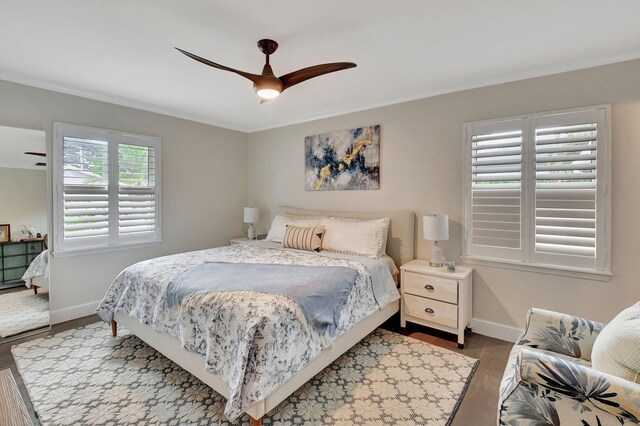 bedroom with hardwood / wood-style floors and ceiling fan