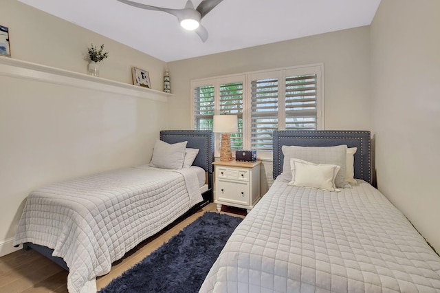 bedroom with ceiling fan and hardwood / wood-style floors