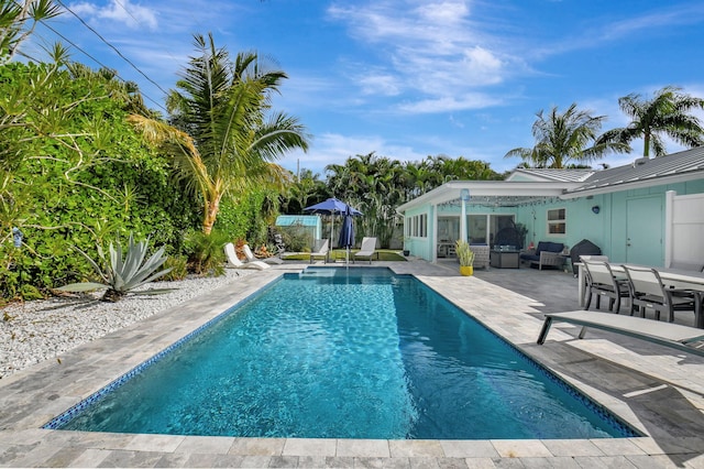 view of swimming pool with a patio area