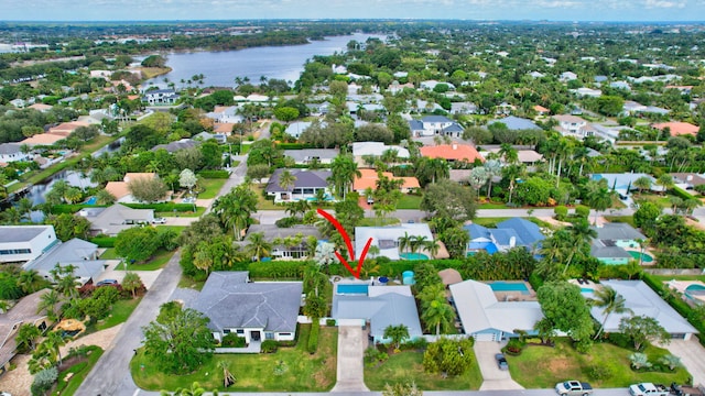 birds eye view of property with a water view