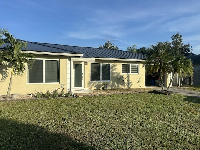 ranch-style home with a front lawn