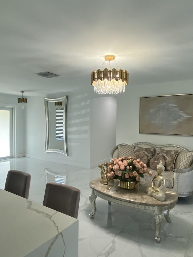 dining area featuring a notable chandelier