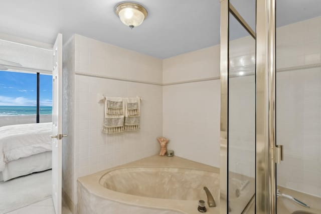 bathroom featuring tile patterned floors and independent shower and bath