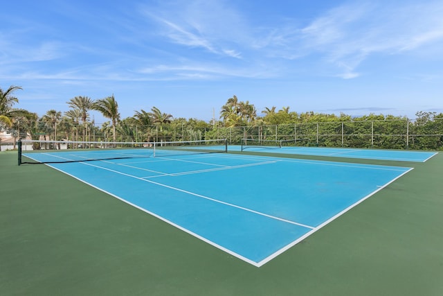 view of tennis court featuring basketball court