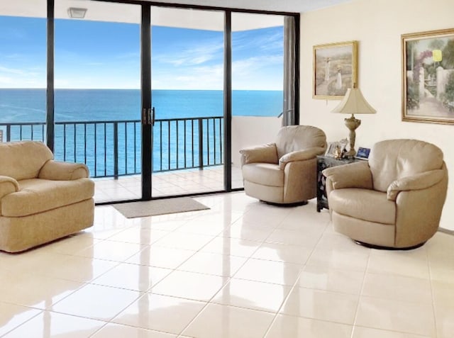 tiled living room with a water view