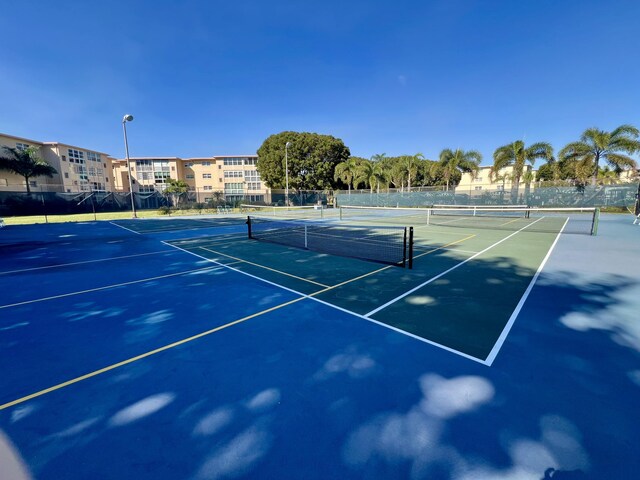 view of sport court with fence