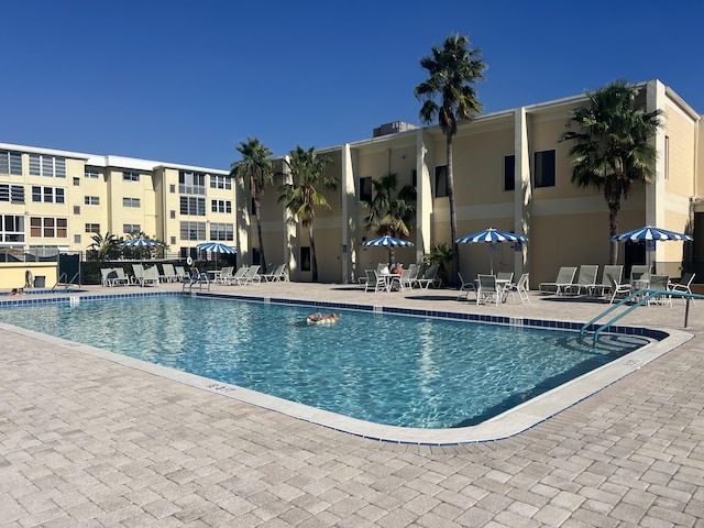 community pool featuring a patio area