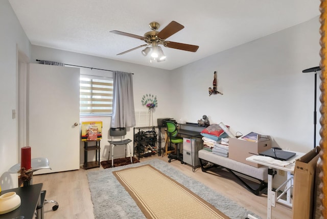 interior space with ceiling fan and light wood-type flooring