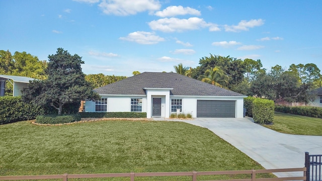 single story home with a garage and a front lawn